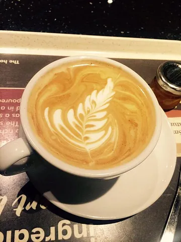flat white: a type of white coffee made with espresso coffee and hot milk, similar to a small latte