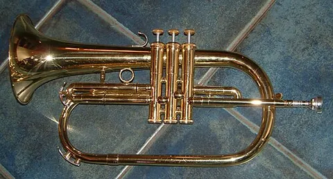 flugelhorn: a brass instrument resembling a cornet but with a wider, conical bore, and usually with three...