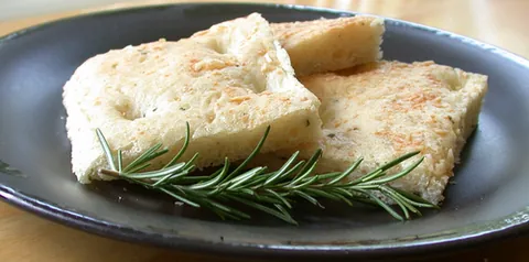 focaccia: a flatbread similar in style, composition, and texture to modern pizza doughs and topped with...