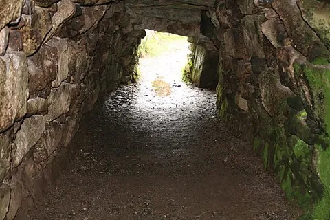 fogou: a Cornish souterrain, an underground, dry-stone-walled chamber open on two ends