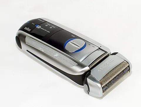 foil shaver: an electric razor with a thin, perforated metal foil covering oscillating blades, which capture...