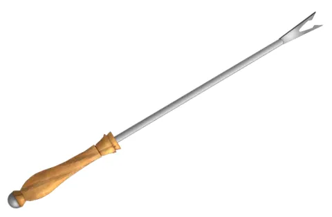 fondue fork: a long fork with heatproof handle for dipping food into fondue