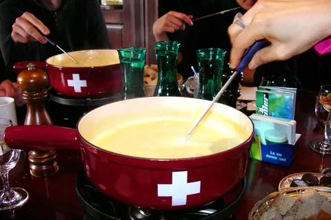 fondue: a dish made of melted cheese, or chocolate etc., or of a boiling liquid into which food can be...