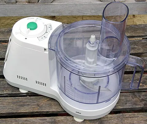 food processor: a small kitchen appliance for chopping or pureeing food