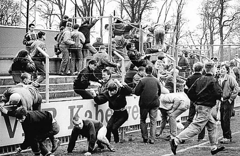 football hooligan: a violent football (soccer) fan who routinely fights with supporters of opposing teams and/or with...