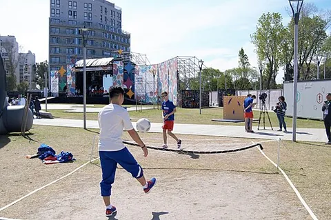 football tennis: a sport played with a ball over a net on a tennis-like court, with the ball similar to the football...