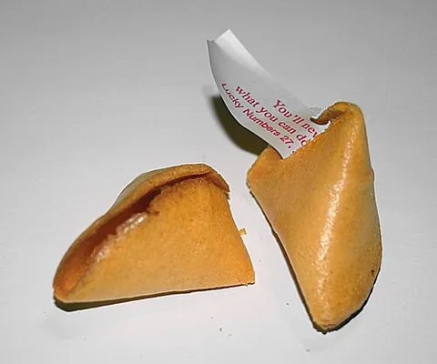 fortune cookie: a type of hollow snack, common in westernized Chinese cuisine: a crisp sugary wafer containing a...