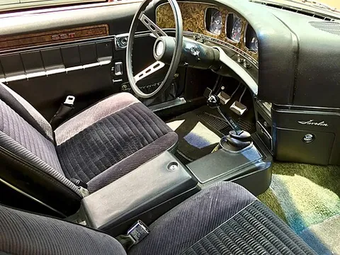 four-on-the-floor: a four-speed manual transmission whose gearshift lever is mounted beside the driver on the floor of...