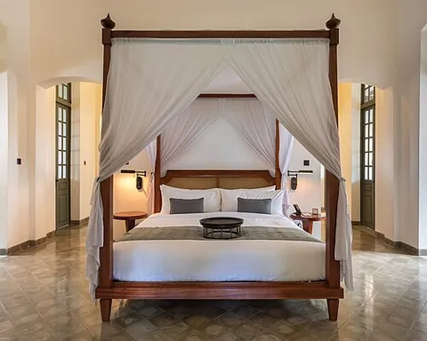 four-poster: having four vertical columns, one in each corner, that support a tester, so that curtains can be...