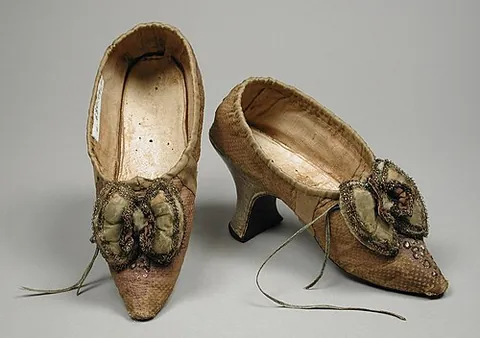 french heel: a curved heel on a woman's shoe that is pitched forward so that the weight of the heel falls on the...