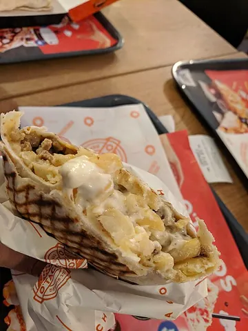 french taco: a press-grilled wrap sandwich originating from France, around Lyon: a type of burrito, where the...