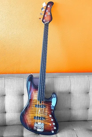 fretless bass: a bass guitar without frets on the neck