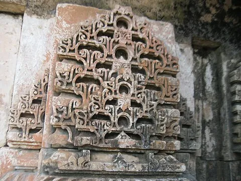 fretwork: ornamental woodwork either carved in low relief or cut through