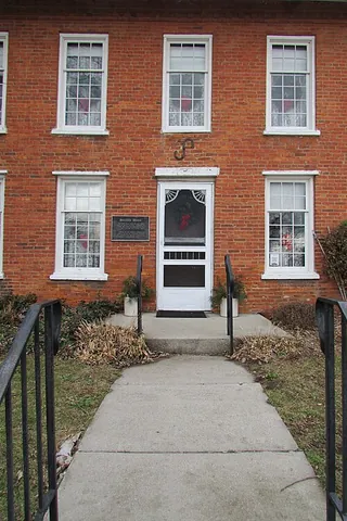 front walk: a walkway leading to the front entrance of a building