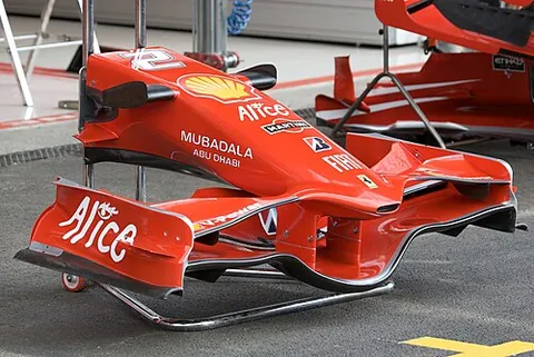 front wing: the section in the front of a Formula One vehicle which deflects the turbulent air that is...