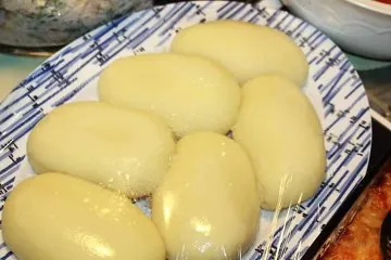 fufu: a dish of boiled, mashed cassava mixed with plantain, yams, or other starchy vegetables, common as...