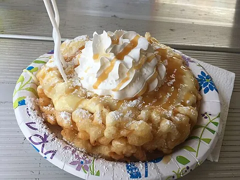 funnel cake: a specialty food made from deep-fried batter and originally associated with the Pennsylvania Dutch...