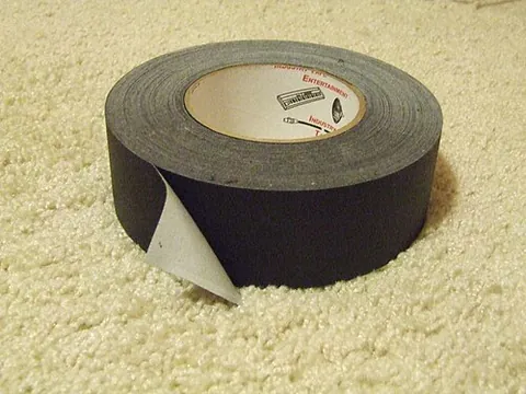 gaffer tape: a sturdy adhesive tape, made of plastic reinforced with cross-linked fibre, often used by stage...