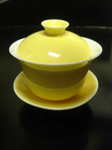 gaiwan: a Chinese lidded cup or bowl, used to steep tea, sometimes including a saucer, developed during the...