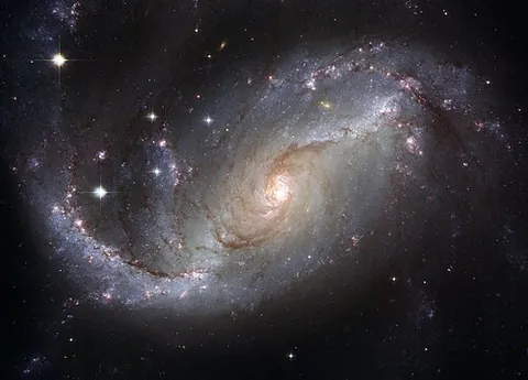 galaxy: the Milky Way; the apparent band of concentrated stars which appears in the night sky over earth