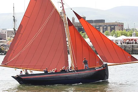galway hooker: a type of fishing boat in the west of Ireland with a distinctive black hull and red sails