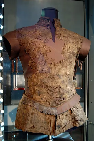 gambeson: a defensive garment formerly in use for the body, made of cloth stuffed and quilted, often worn as...