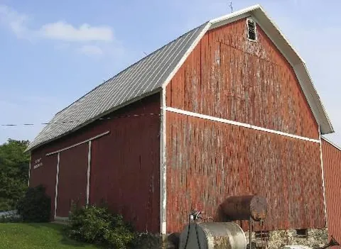 gambrel roof: a roof design having two slopes on the sides and gables in the ends