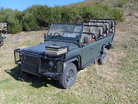 game viewer: a usually roofless off-road motor vehicle that transports people through a game reserve to observe...