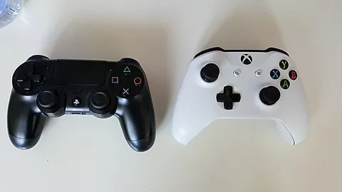 gamepad: a type of game controller held in both hands and controlled with the thumbs
