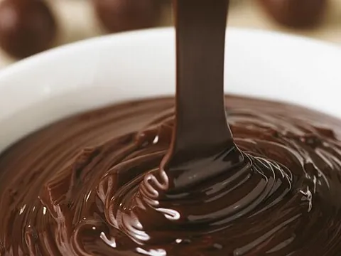 ganache: a rich sauce, made of chocolate and cream, used also as the filling of truffles, and as a glaze