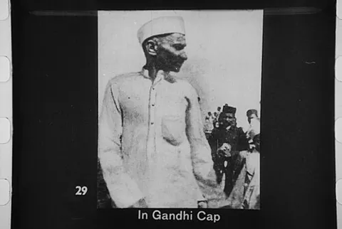 gandhi cap: a white side cap, pointed in front and back and having a wide band, worn as a symbol of Indian...