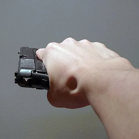 gangsta hold: the act of holding a gun sideways