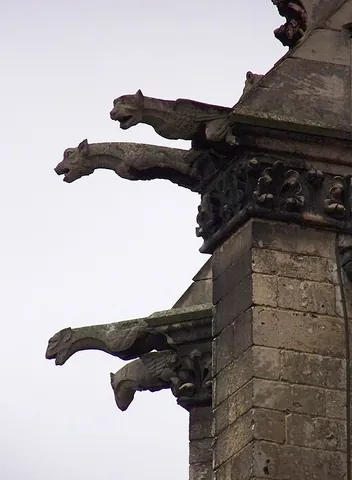 gargoyle: a carved grotesque figure on a spout which conveys water away from the gutters