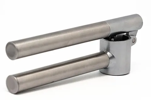 garlic press: a utensil used to crush garlic
