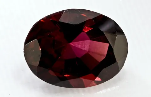 garnet: a hard transparent mineral that is often used as gemstones and abrasives