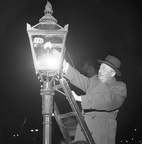 gaslight: a lamp which operates by burning piped illuminating gas (or town gas)