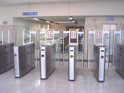 gateline: a row of turnstiles allowing passengers to enter or exit a place on inserting tickets