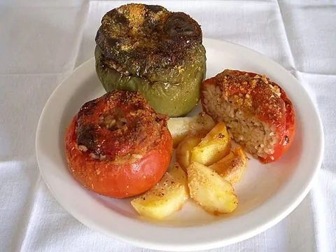 gemista: popular Greek dish of tomatoes and green peppers stuffed with rice (occasionally minced meat is...