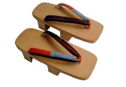 geta: a Japanese raised wooden clog, worn with traditional Japanese garments such as the kimono