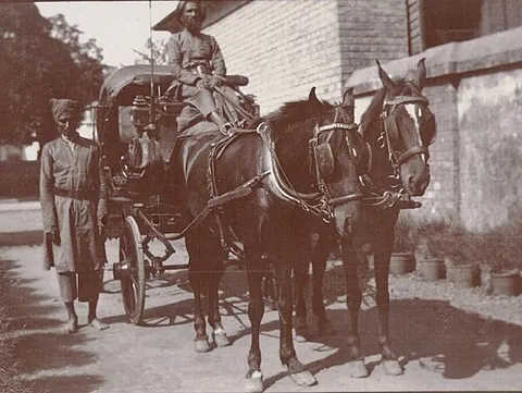 gharry: a wheeled cart or carriage, usually horsedrawn