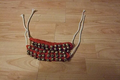 ghungroo: a small metallic bell, usually part of a set strung together and worn on an anklet, especially by...