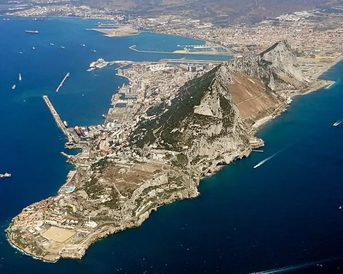 gibraltar: a peninsula, city, and overseas territory of the United Kingdom, at the southern end of Iberia