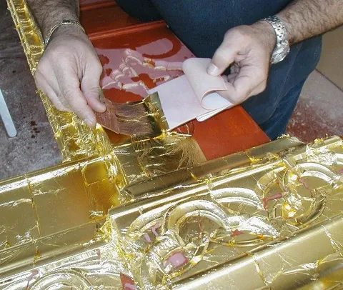 gild: to cover with a thin layer of gold; to cover with gold leaf
