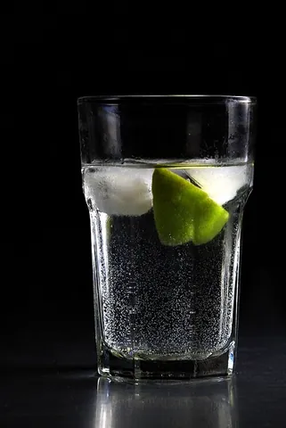 gin and tonic: a simple cocktail made from gin and tonic water, often served on ice and with a slice of lime or...