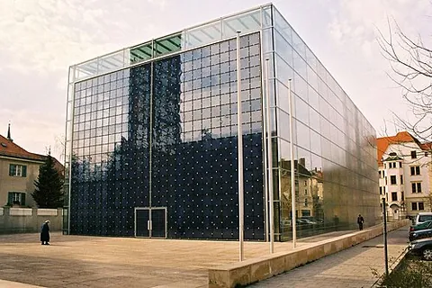 glassy: of or like glass, especially in being smooth and somewhat reflective
