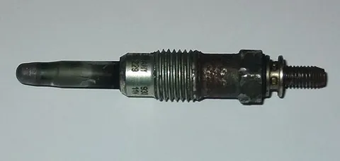 glow plug: a device in a diesel engine that heats the combustion chamber to help ignition
