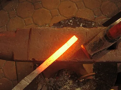 glow: to emit heat and light without a flame