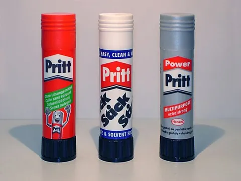 glue stick: a solid adhesive in a twist- or push-up tube, most commonly seen in schools and offices