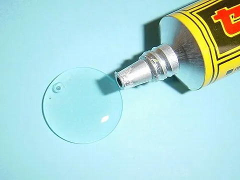 glue: a hard gelatin made by boiling bones and hides, used in solution as an adhesive; or any sticky...