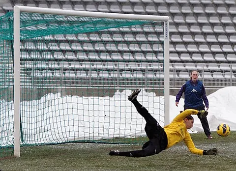 goalkeeper: a designated player that attempts to prevent the opposing team from scoring by protecting a goal